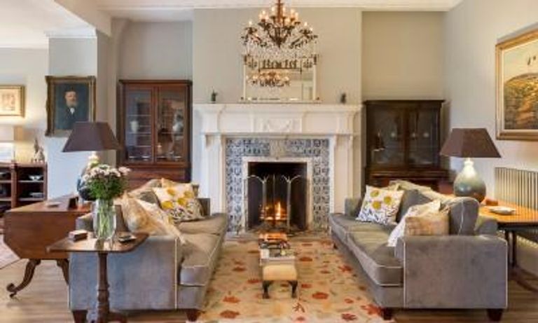 Living room with fireplace and matching sofas