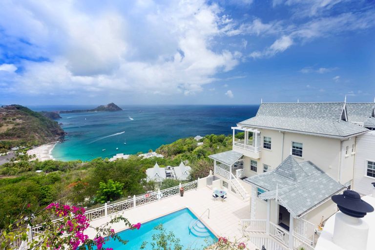 View of villa with a pool overlooking the beach, St Lucia