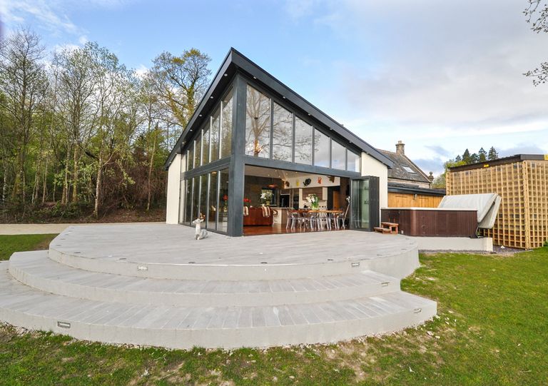 House with tall glass windows in Loch Lomond