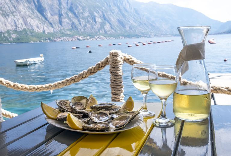 Oysters And White Wine In A Restaurant With A Sea View