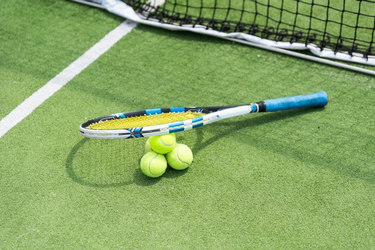 Tennis Racket And Ball On A Tennis Court