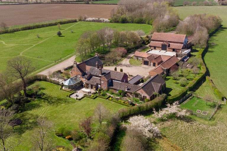 Aerial shot of manor house estate in Norfolk, UK