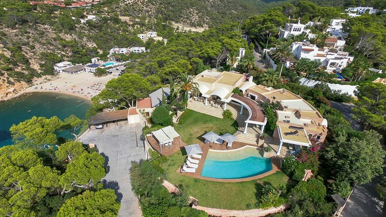 Aerial view of villa next to a beach